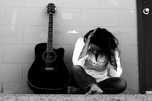 sad boy and girl with guitar