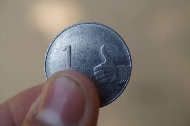 thumbs up coin