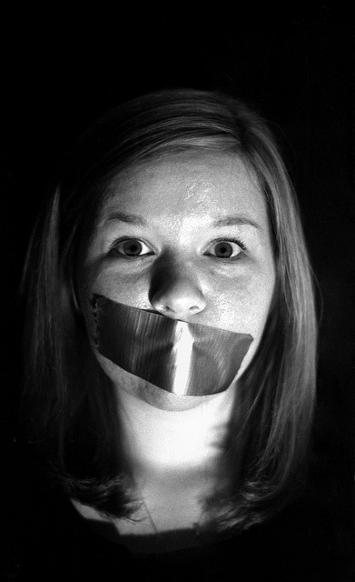 Girl with duct tape over mouth