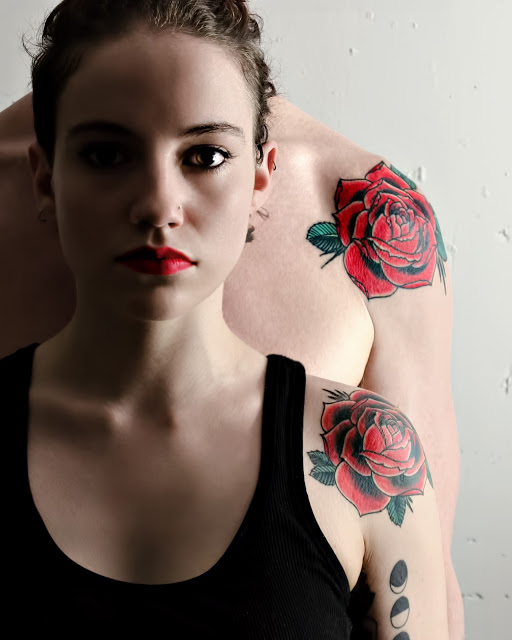 male:female with rose tattoos