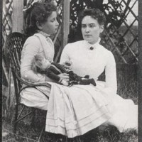 Hellen_Keller_holding_doll_with_Ann_Sullivan_1888