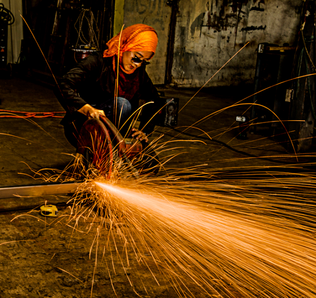 woman working welding job trade career