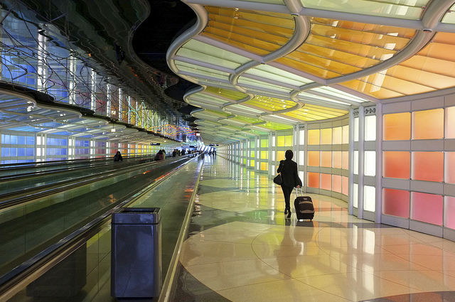 airport traveller woman walking luggage