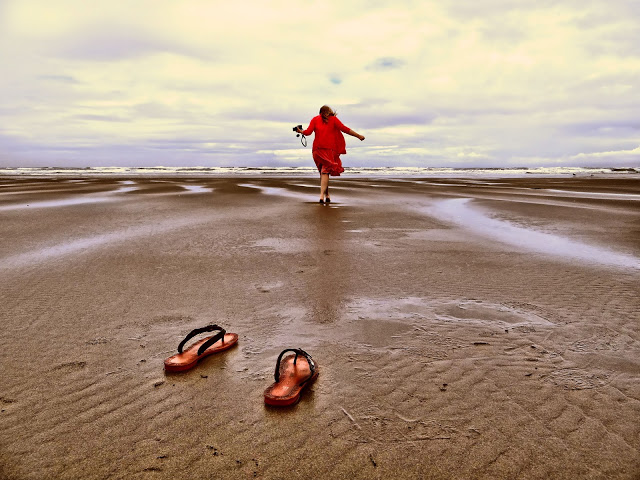 walk barefoot in sand on beach woman