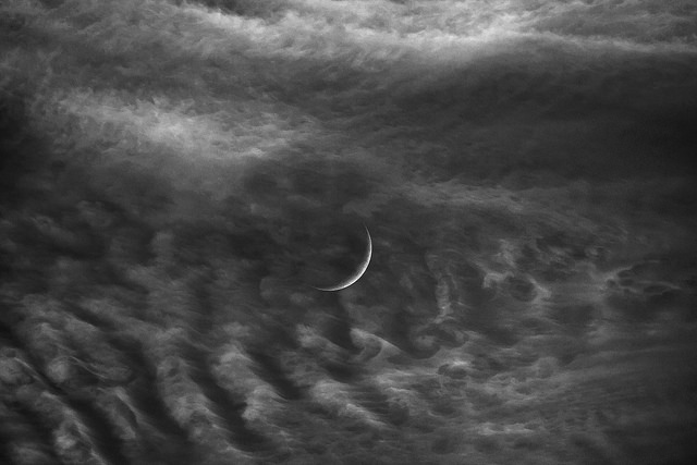 new moon waxing clouds
