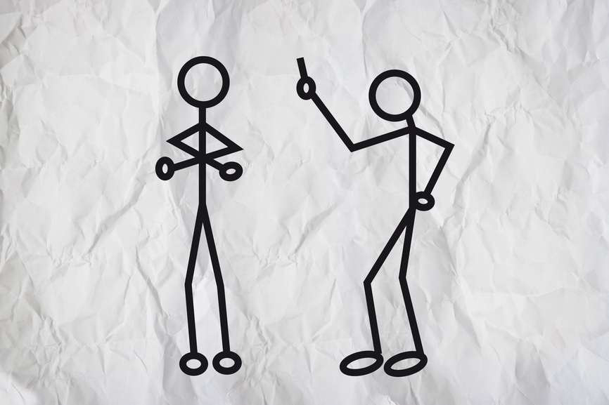 Simple drawing of two humanoid figures having anargue over a paper texture