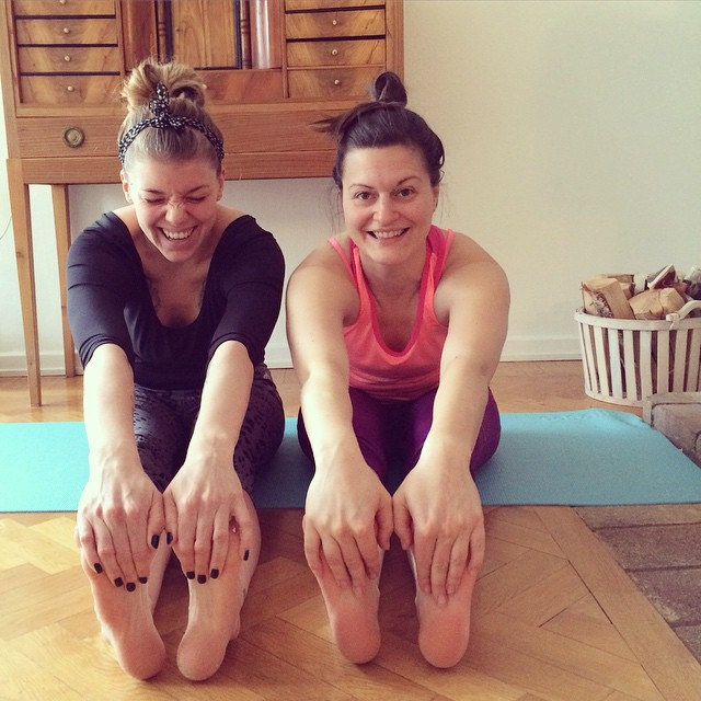 yoga girls touching toes friends