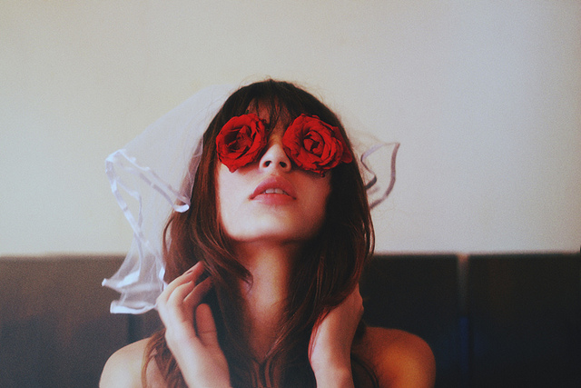 woman roses over eyes