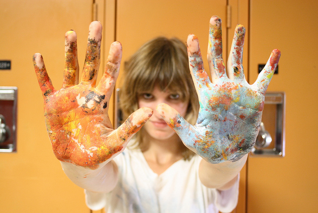 woman mess hands paint