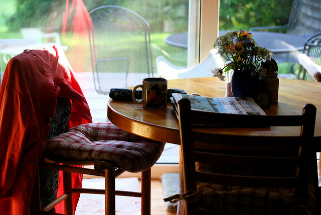 kitchen table paper morning coffee alone