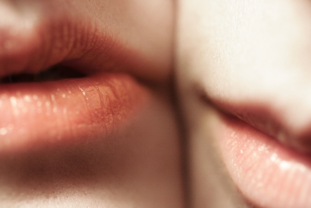 couple lips cheek to cheek love