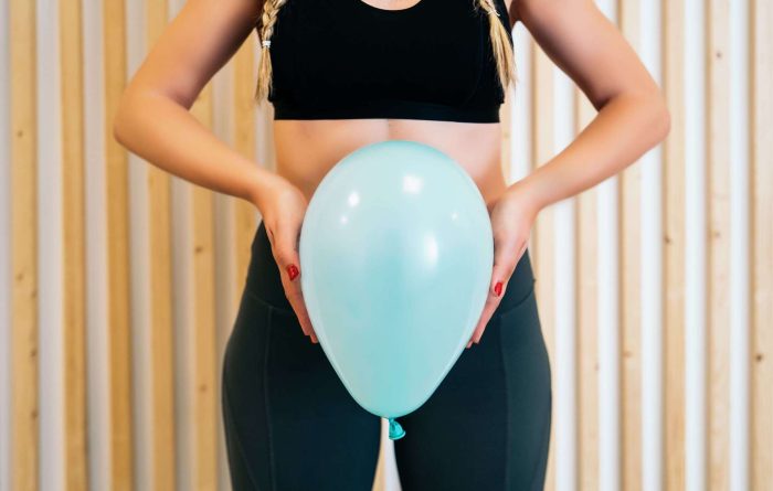 MaruPadilla/AdobeStock https://stock.adobe.com/images/close-up-of-a-young-woman-holding-a-balloon-to-explain-the-diaphragm-zones-core-and-pelvic-floor-pelvic-floor-exercises-explained/348325453