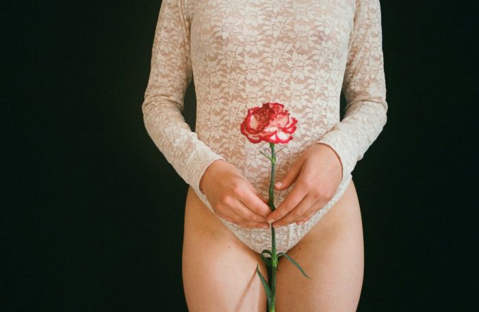 Darya Sannikova/Pexels https://www.pexels.com/photo/woman-holding-red-rose-flower-2526819/