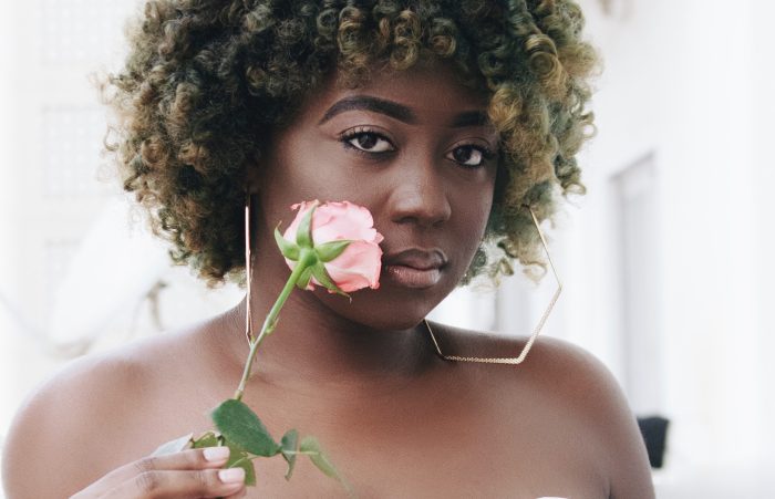 Tubarones Photography/Pexels https://www.pexels.com/photo/a-woman-in-white-dress-holding-a-flower-4887226/