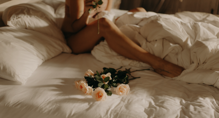 Ksu&Eli/Pexels https://www.pexels.com/photo/woman-sitting-in-a-bed-with-white-roses-8723278/