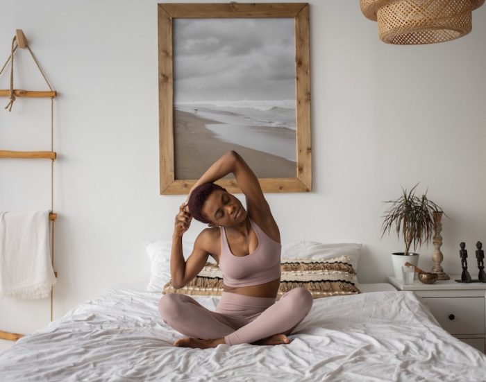 EKATERINA BOLOVTSOVA/Pexels https://www.pexels.com/photo/a-woman-doing-a-yoga-exercise-on-the-bed-7113443/