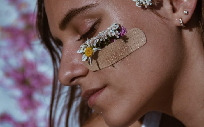 Lena Glukhova/Pexels https://www.pexels.com/photo/woman-with-bandage-and-flowers-on-face-8993698/